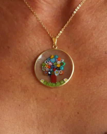 clear glass pendant with colorful millefiori tree set in gold, lots of pop