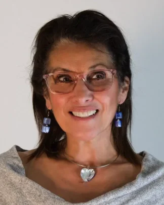 blue and silver heart on model