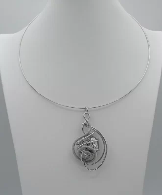 swirling rhodium metal design pendant with a large Murano glass silver bead