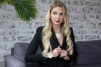 model wearing large Murano glass textured disc pendant and matching bracelet