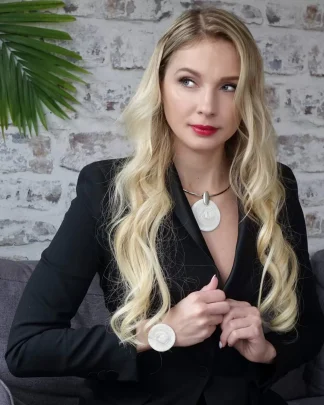 model wearing large Murano glass textured disc pendant and matching bracelet