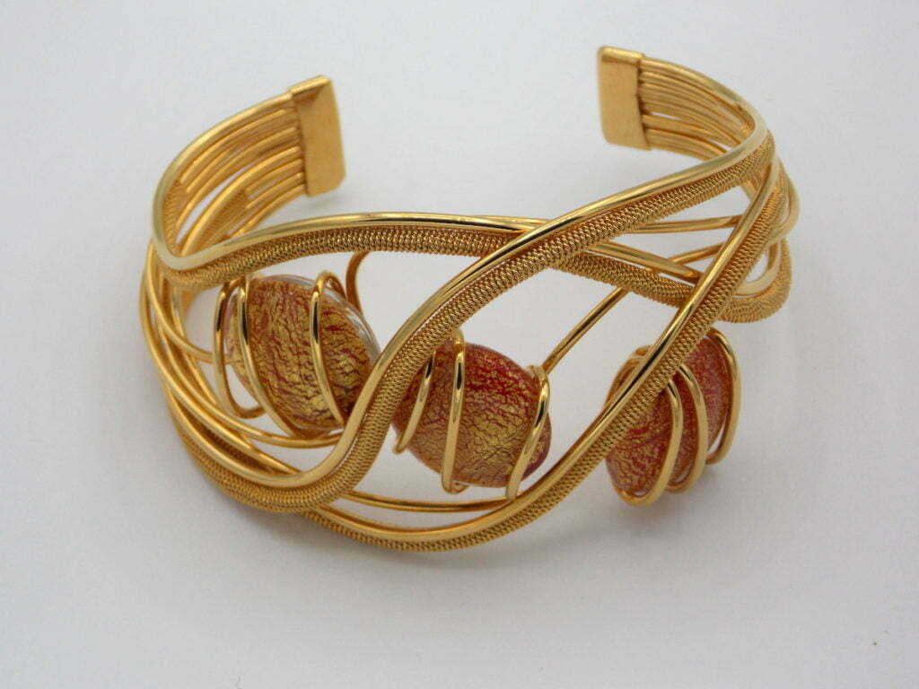 Woven rhodium gold plated metal cuff bracelet with red and gold murano glass beads