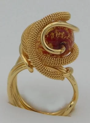 Detailed gold plated rhodium metal ring with red and gold Venetian glass bead