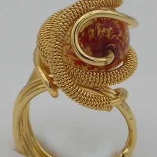 Detailed gold plated rhodium metal ring with red and gold Venetian glass bead