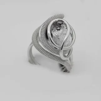 swirls of detailed wire wrapped silver tone metal create a dome ring with a silver and black Murano glass bead nickel free