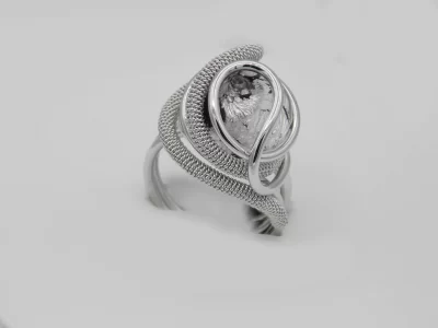 swirls of detailed wire wrapped silver tone metal create a dome ring with a silver and black Murano glass bead nickel free