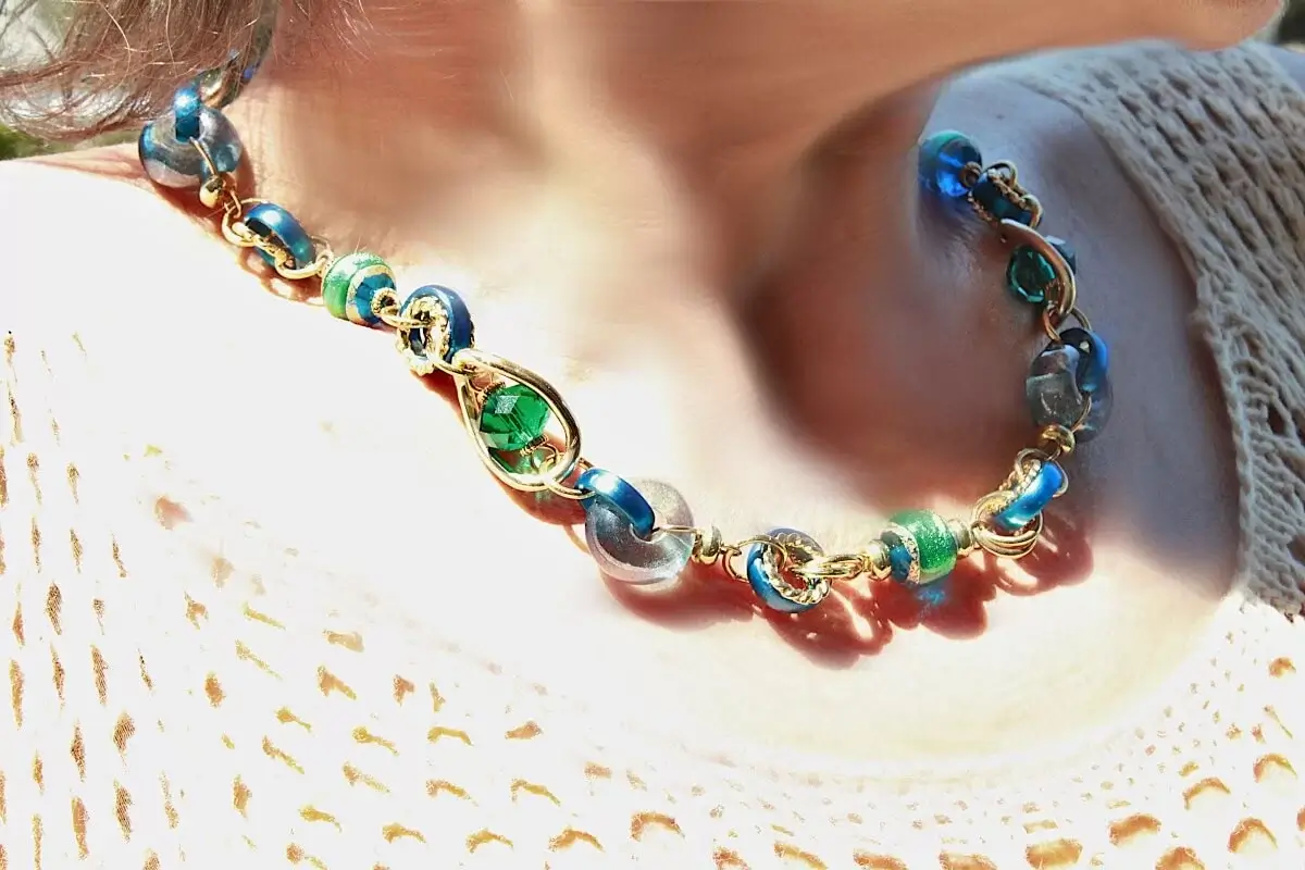 varied detailed Murano glass beads necklace in blues and greens and golds