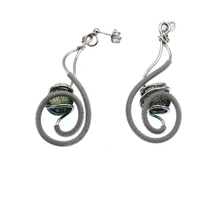 Swirl hand wrapped rhodium silver tone drop earrings withgreen Murano glass bead