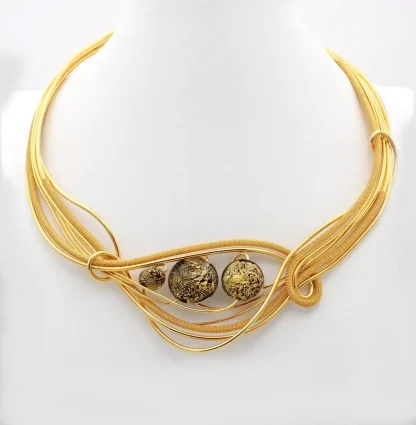 gold rhodium metal hand woven into an elaborate collar necklace with 3 black and gold Murano glass beads