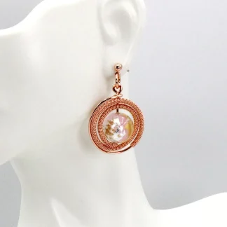 Rose gold circular drop earrings with shiny Murano glass bead at center