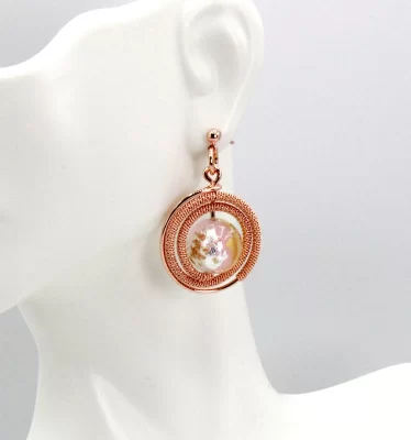 Rose gold circular drop earrings with shiny Murano glass bead at center