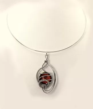 Arabesque shape silver pendant on a collar necklace with a fiery bronze Murano glass bead