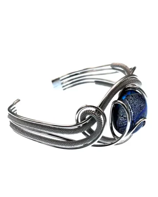 Serpentine cuff bracelet with wire wrapping and a blue Murano glass bead