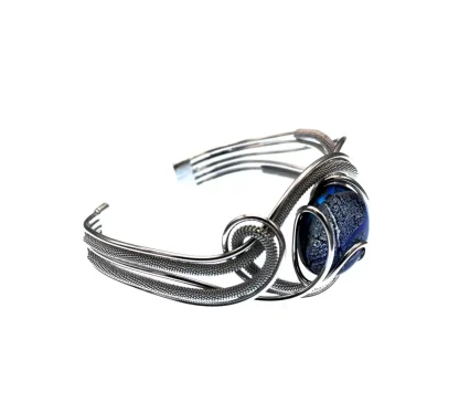 Serpentine cuff bracelet with wire wrapping and a blue Murano glass bead