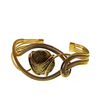 golden serpentine cuff bracelet with single Murano black and gold bead