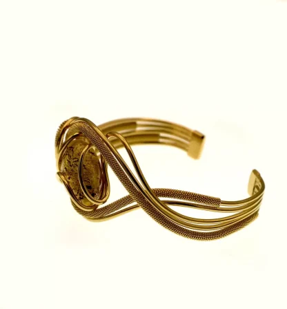 golden serpentine cuff bracelet with one Murano glass bead