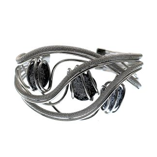 Cuff bracelet waves of silver with wire wrapping around frame holds three grey Murano glass beads