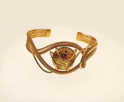 Serpentine shaped cuff bracelet with multi-strands wrapped wire and a gold Murano glass bead