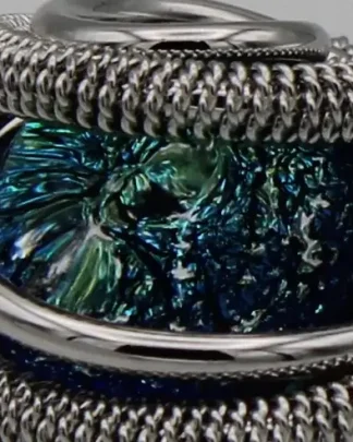 Swirling silver tone rhodium dome ring with aqua Murano glass bead