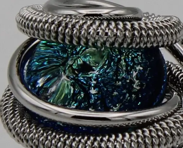 Swirling silver tone rhodium dome ring with aqua Murano glass bead