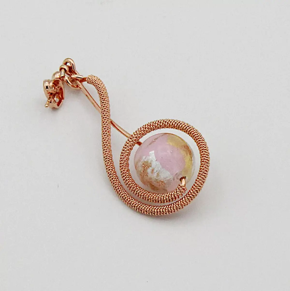 Rose gold tone arabesque shaped long earrings with pinkish Murano glass bead