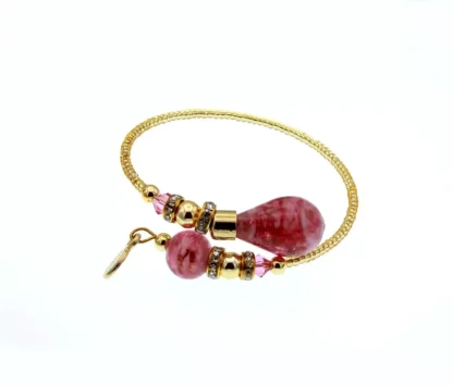 Murano glass wrap bracelet with gold glass beads and large pink beads at its ends, mini bling and gold details
