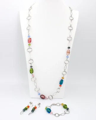 Murano glass multicolor glass beads interspersed on a long beveled chrome chain reflecting light