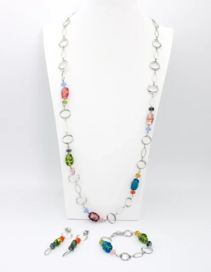 Murano glass multicolor glass beads interspersed on a long beveled chrome chain reflecting light