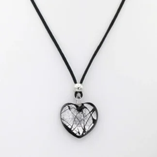 Heart shaped Murano glass silver infusion necklace on a bed of black glass on a 16 inch silk cord