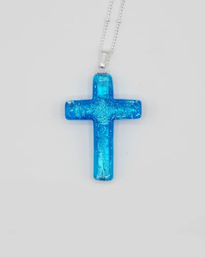 Murano glass cross, 1 1/2 inch long, cyan (turquoise) color with infused silver on a silver plated satellite chain
