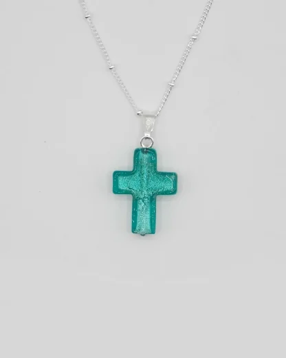 Small 3/4 inch aqua Murano glass cross with silver infusion on a silver plated satellite chain