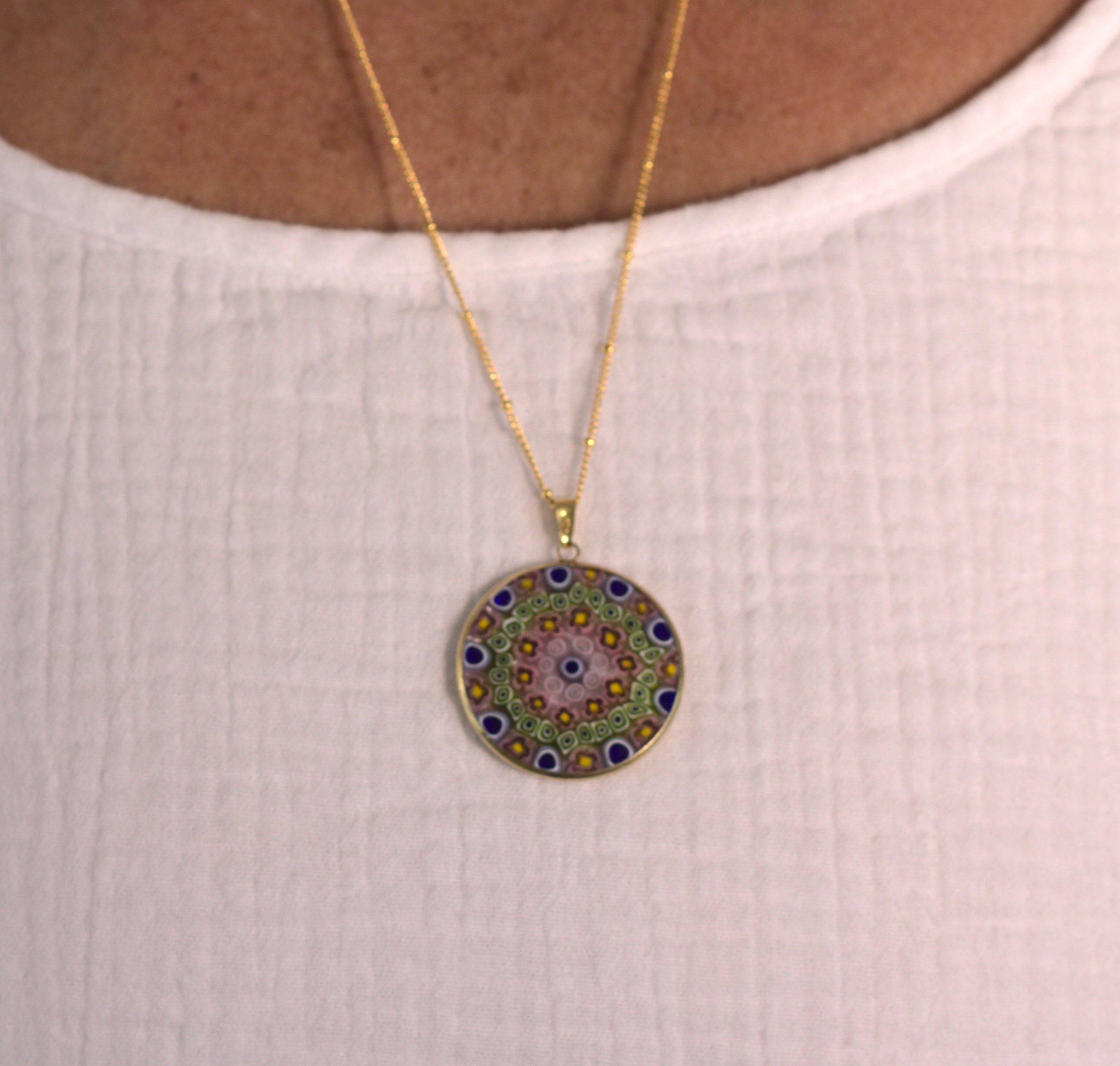 Millefiori in Earth tones and blue on model