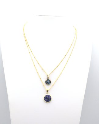 Two millefiori blue tone gold encased small millefiori pendants on gold chains layered