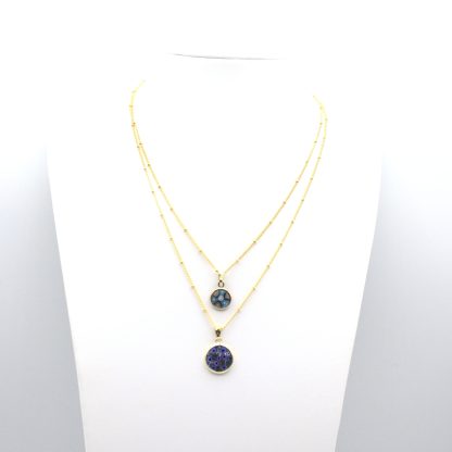 Two millefiori blue tone gold encased small millefiori pendants on gold chains layered