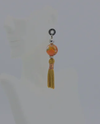 Murano orange long earrings with tassels and bead and green and honey color Murano necklace on model