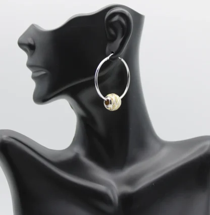 Sterling silver hoop earring with gold and silver Pandora style bead