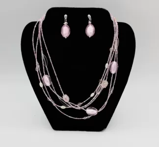 Lustrous pink multi strand graduated beaded necklace with matching earrings