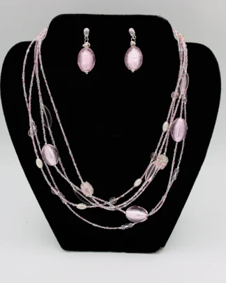 Lustrous pink multi strand graduated beaded necklace with matching earrings