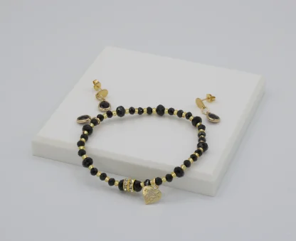 Dramatic delicate ebony Murano glass stretch bracelet with matching delicate drop earrings on post with gold details
