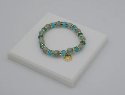 Light blue tones Murano glass bead stretch bracelet with bling and gold charm detail