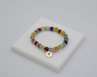 Multi colored Murano glass bead stretch bracelet with bling and gold charm detail