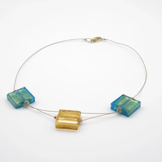 Murano glass cube necklace 2 aqua color cubes and one dropped gold cube on a titanium necklace