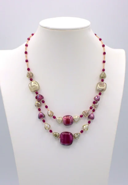 Murano glass dramatic double strand necklace in deep rose color and lustrous sand and neutral tones set with bracelet and earring, necklace view