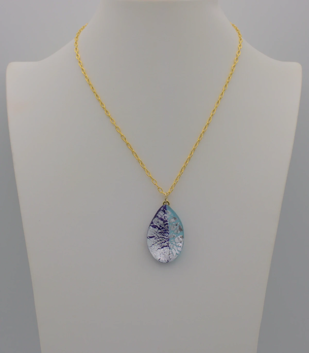 Murano double blues two toned and silver infusion teardrop pendant on a 16 inch gold chain