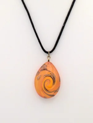 Orange Murano glass pendant with copper swirls, teardrop shape on cord