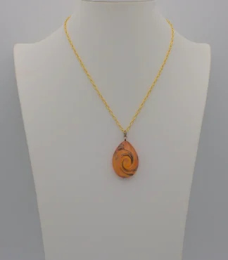 Murano glass orange teardrop pendant with copper swirls on black cotton cord