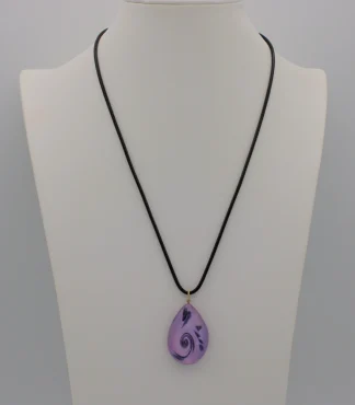 Murano glass purple scroll teardrop pendant on a black cotton cord