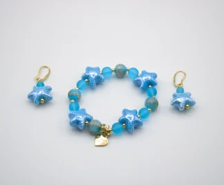 Blue tones Murano glass stretch bracelet with starfish and other blue tone beads with copper infusion