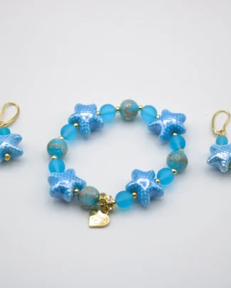 Blue tones Murano glass stretch bracelet with starfish and other blue tone beads with copper infusion