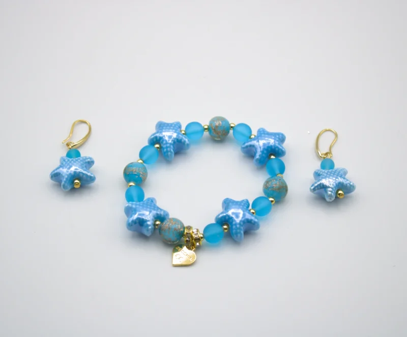 Blue tones Murano glass stretch bracelet with starfish and other blue tone beads with copper infusion